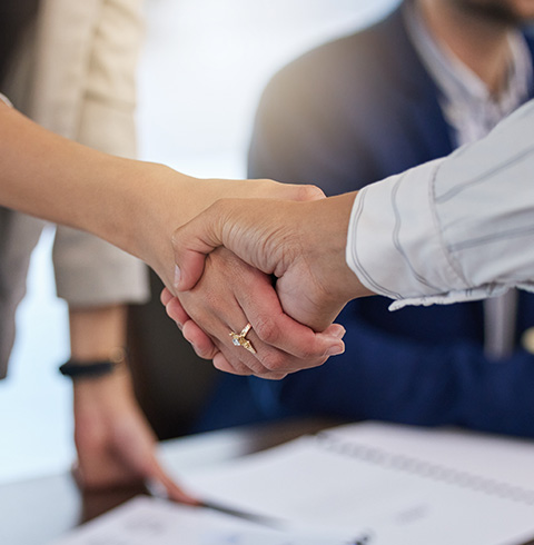 business handshake focusing on collaboration and success in a meeting with eight key strategies for growth