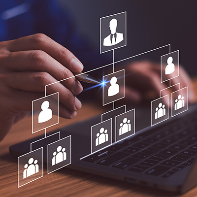 person typing on a laptop with virtual icons representing technology and analytics focused on improvement and efficiency related to six key indicators