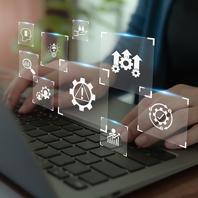 hands using a pen to interact with a digital organizational chart on a laptop showing people icons representing leadership and team structures online networking