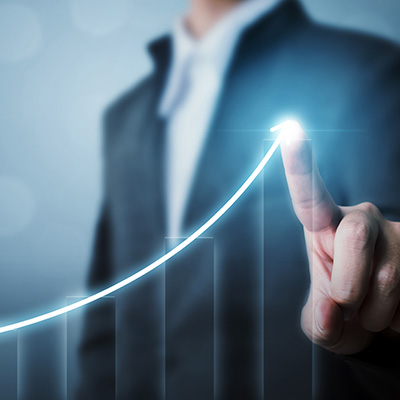 businessman pointing at a rising graph line symbolizing growth and success in the ninth quarter