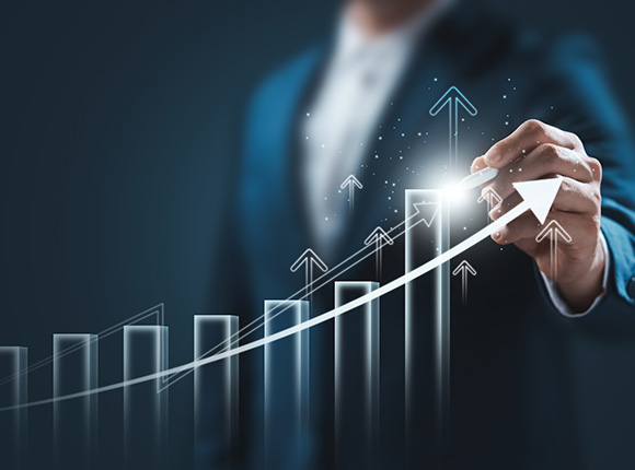 businessman drawing upward trend on graph representing growth strategies for seven successful years
